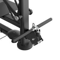 Close-up of a black metal frame with adjustable levers on a white background
